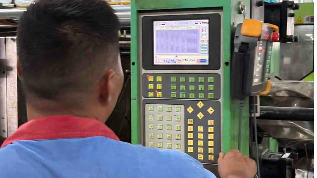 The PP mold in the clamped state on a vertical injection molding machine