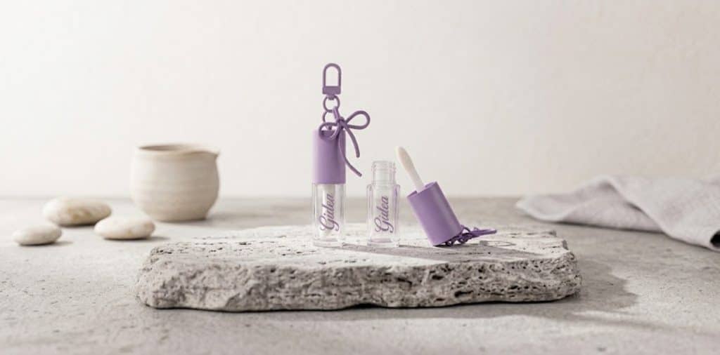stylish portable container with bow charm keychain lip oil5
